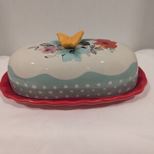 The Pioneer Woman Polka Dot Floral Butter Dish with Red and Yellow Accents.